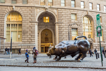 NEW YORK CITY - FEB 11: The landmark Charging Bull in Manhattan represents aggressive financial optimism and prosperity on February 11, 2015. in New York City.のeditorial素材