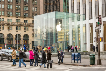 NEW YORK CITY - FEB 13: Shopping street at 5th Avenue in NYC with tourists on  February 13, 2015. It is considered among the most expensive and best shopping streets in the world.のeditorial素材