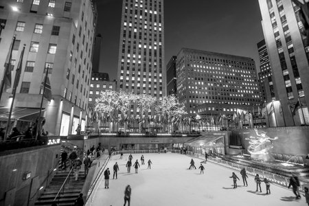 NEW YORK CITY - FEB 11: Ice skaters and tourists are all around the famous Rockefeller Center  during the holidays on February 11, 2015 in Manhattan, New York City.のeditorial素材