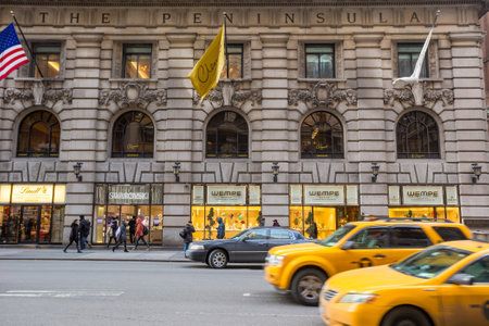 NEW YORK CITY - FEB 13: Shopping street at 5th Avenue in NYC with tourists on  February 13, 2015. It...