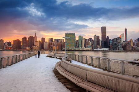 New York City with skyscrapers illuminated over Hudson River panoramaの写真素材