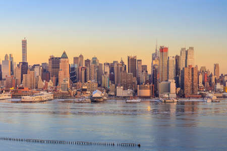 New York City with skyscrapers illuminated over Hudson River panoramaの写真素材
