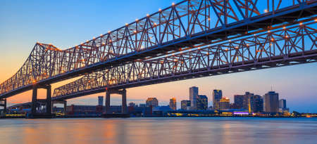 The Crescent City Connection Bridge on the Mississippi river and downtown New Orleans Louisianaの写真素材