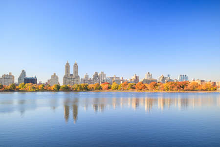 Central Park in Autumn with colorful trees and skyscrapersの写真素材