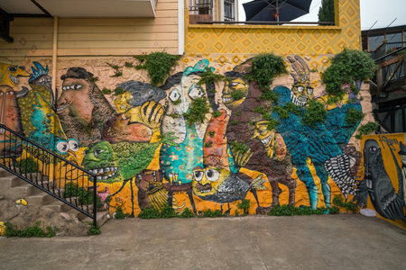 VALPARAISO, CHILE - May 16, 2016: Colourful street art decorating houses in the UNESCO World Heritage port city of Valparaiso in Chile.のeditorial素材