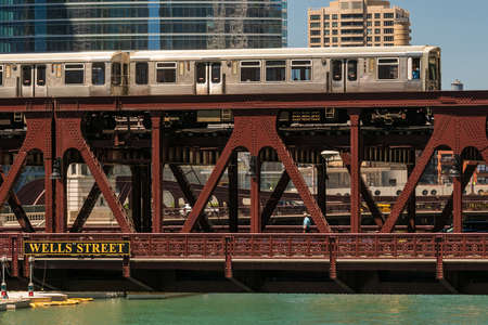 Train in downtown Chicago and a vintage steel bridgeの写真素材