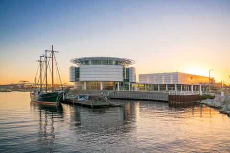 Milwaukee skyline at twilight with city reflection in lake Michigan and harbor pier.のeditorial素材