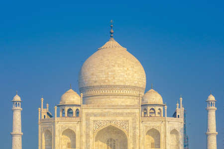 Taj Mahal on a bright and clear day with blue skyの写真素材