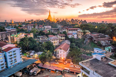 Yangon skyline at twilight with Shwedagon Pagoda  in Myanmarの写真素材