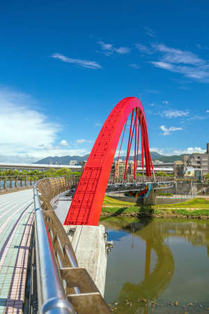 Bridge with Taipei skyline in Taiwan with blue skyの写真素材