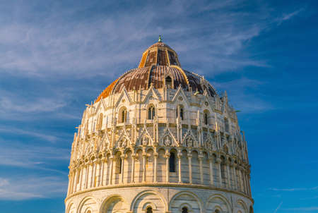 Pisa Baptistry of St. John in a sunny day in Italy.の写真素材