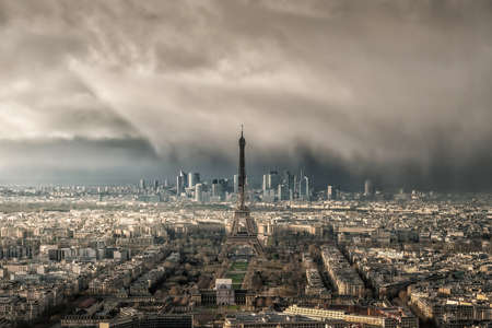 Skyline of Paris with Eiffel Tower with snow storm in France from top viewの写真素材