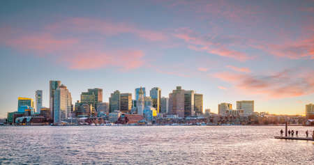 Panorama view of Boston skyline with skyscrapers over water at twilight in United Statesの写真素材