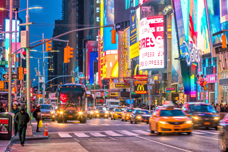 NEW YORK CITY - March 9: Times Square area with neon art and commerce, an iconic street of Manhattan...