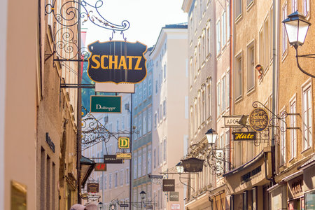 Salzburg, Austria - August 12, 2018:  Getreidegasse street - famous shopping street in Salzburg old town.のeditorial素材