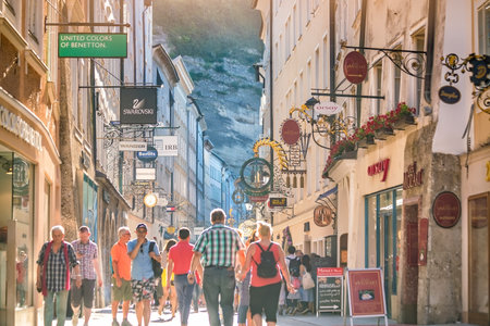 Salzburg, Austria - August 12, 2018:  Getreidegasse street - famous shopping street in Salzburg old town.のeditorial素材