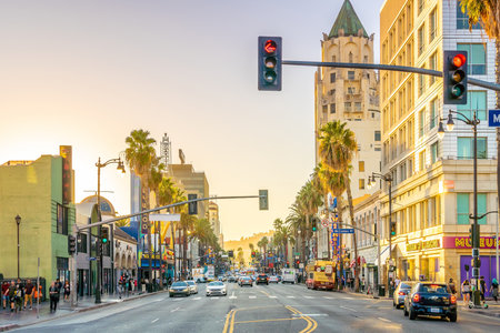View of world famous Hollywood Boulevard district in Los Angeles, California, USA at sunset.