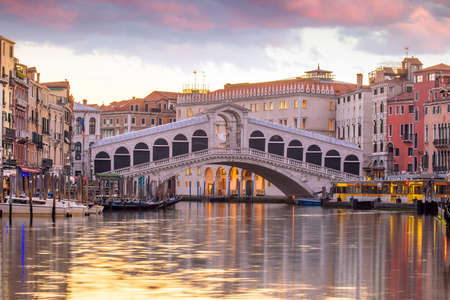 Cityscape image of Venice, in Italy during sunrise with Gondolasの写真素材