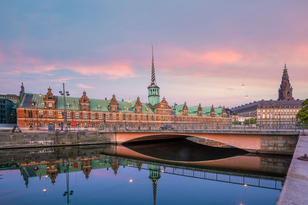 Cityscape of downtown Copenhagen city skyline in Denmark at sunset