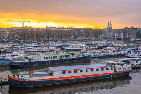 Amsterdam downtown city skyline cityscape of Netherlands at sunsetの写真素材