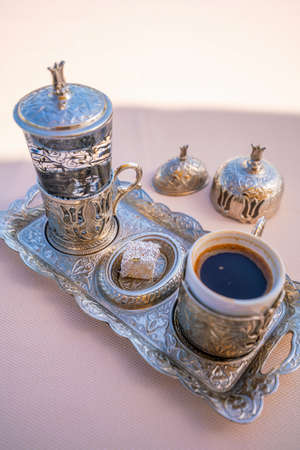 Turkish coffee with delight and traditional metal serving set in Istanbulの写真素材