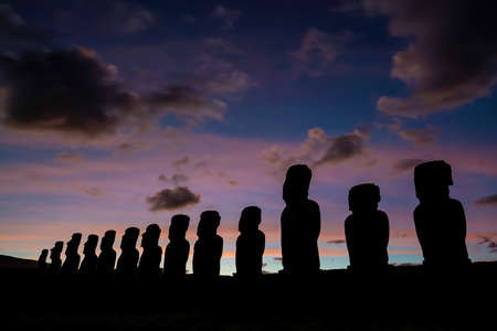 The ancient moai of Ahu Togariki, on Easter Island of Chile at sunriseの写真素材