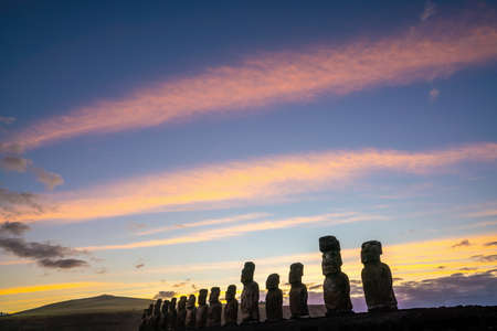 The ancient moai of Ahu Togariki, on Easter Island of Chile at sunriseの写真素材