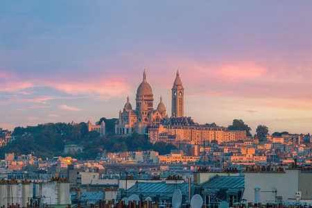Sacre Coeur Cathedral on Montmartre Hill, Paris in France at sunsetの写真素材