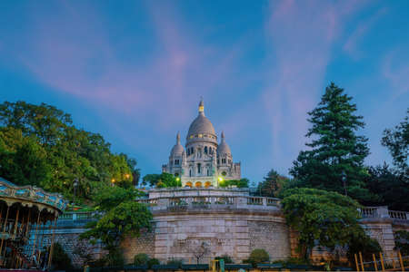 Sacre Coeur Cathedral on Montmartre Hill, Paris in France at twilightの写真素材