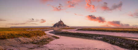 Famous Le Mont Saint-Michel island in Normandy, northern France at sunsetの写真素材