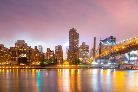 Manhattan city skyline cityscape of New York with Queen Bridge in USAの写真素材