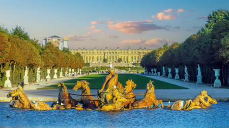 Garden of Chateau de Versailles and Apollo's fountain, near Paris in France at sunsetのeditorial素材