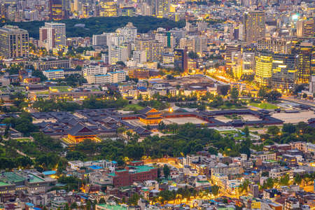 Downtown Seoul city skyline with Gyeongbokgung Palace, cityscape of South Korea at sunset