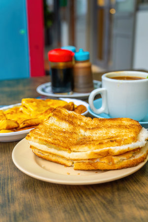 Traditional breakfast set and coffee, boiled eggs and toast, popular in Singapore and Malaysiaの写真素材