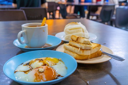 Traditional breakfast set and coffee, boiled eggs and toast, popular in Singapore and Malaysiaの写真素材