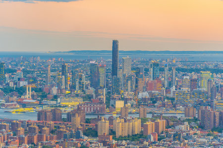 Cityscape of downtown Brooklyn skyline  from Manhattan New York City at sunsetの写真素材