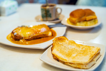 Eggs, toast with Kaya and Butter and coffee, traditional breakfast meal in Kuala Lumpurの写真素材