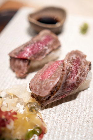 Japanese raw beef sushi with rice in Tokyo Japanの写真素材