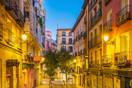 Madrid, Spain - February 10, 2023: Downtown Madrid, shopping street area at nightの写真素材