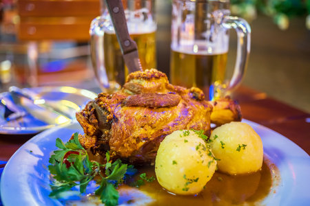 Deep fried pork knuckle  in Frankfurt, German with potato and beerの写真素材