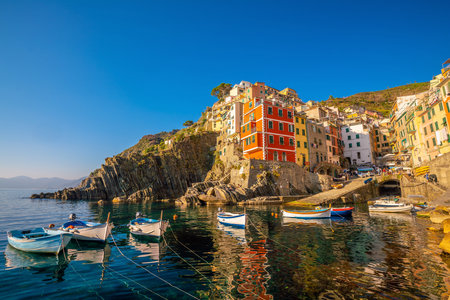 Colorful cityscape of buildings over Mediterranean sea, Europe, Cinque Terre, traditional Italian architectureの写真素材