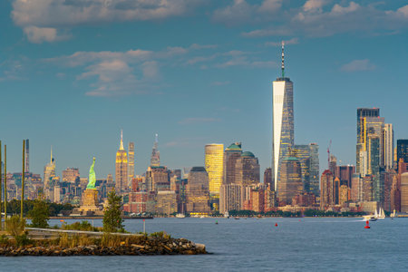 Manhattan's skyline, cityscape of New York City in the United State of America with the Statue of Libertyの写真素材
