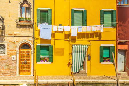View of the colorful Venetian houses at the Islands of Burano in Veniceの写真素材