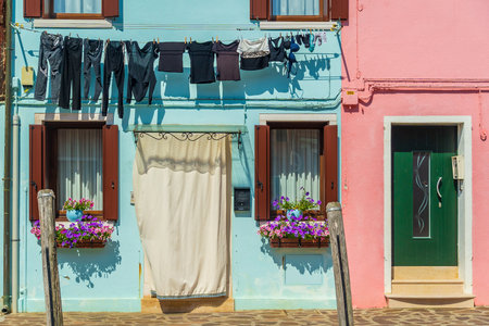 View of the colorful Venetian houses at the Islands of Burano in Veniceの写真素材