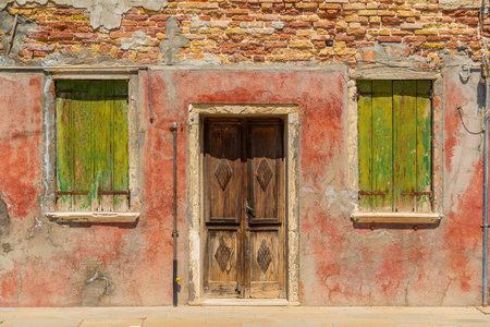 View of the colorful Venetian houses at the Islands of Burano in Veniceの写真素材