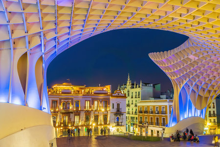 Metropol Parasol wooden structure with Seville city skyline in the old quarter of Seville in Spain at sunsetの写真素材