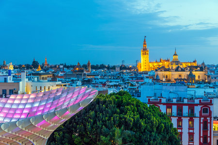 Metropol Parasol wooden structure with Seville city skyline in the old quarter of Seville in Spain at sunsetの写真素材