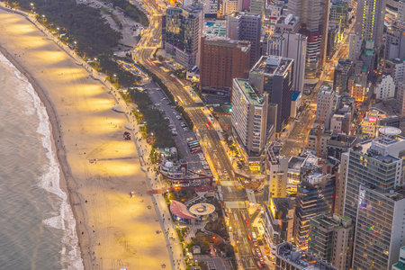 Busan city skyline at Haeundae district, cityscape of South Korea at sunsetの写真素材