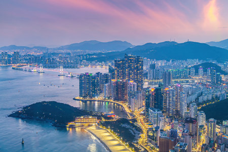 Busan city skyline at Haeundae district, cityscape of South Korea at sunsetの写真素材