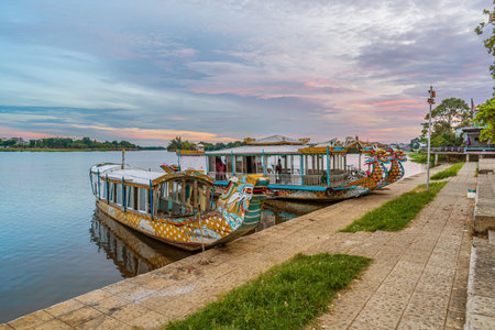 Traditional Dragon boat in Hue Vietnam at twilightの写真素材